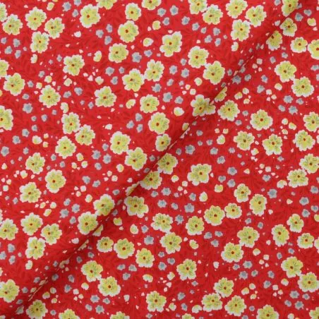 Tissu coton rouge imprimé fleuri jaune