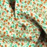 Tissus en viscose blanc imprimés fleuris orange et vert Tissus en viscose blanc imprimés fleuris orange et vert