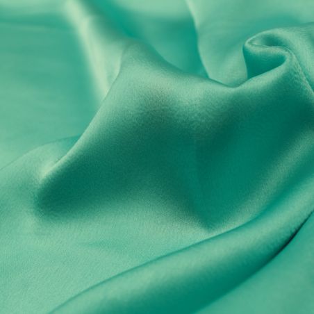 Tissu satin polyester bleu turquoise uni – Haute qualité pour couture et décoration Tissu satin polyester bleu turquoise uni – Haute qualité pour couture et décoration