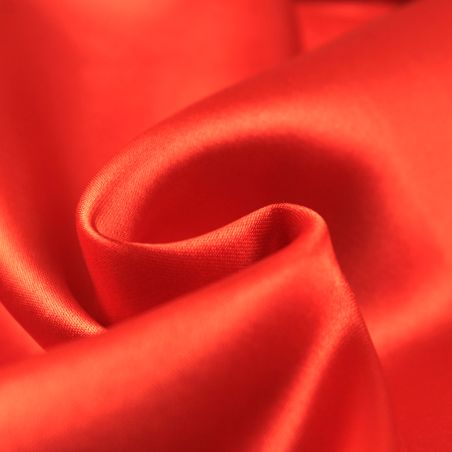 Tissus satin polyester orange perlé Tissus satin polyester orange perlé