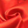 Tissus satin polyester orange perlé Tissus satin polyester orange perlé
